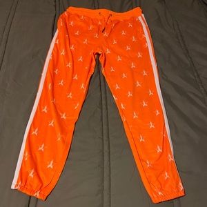 Orange Jeffree Star joggers